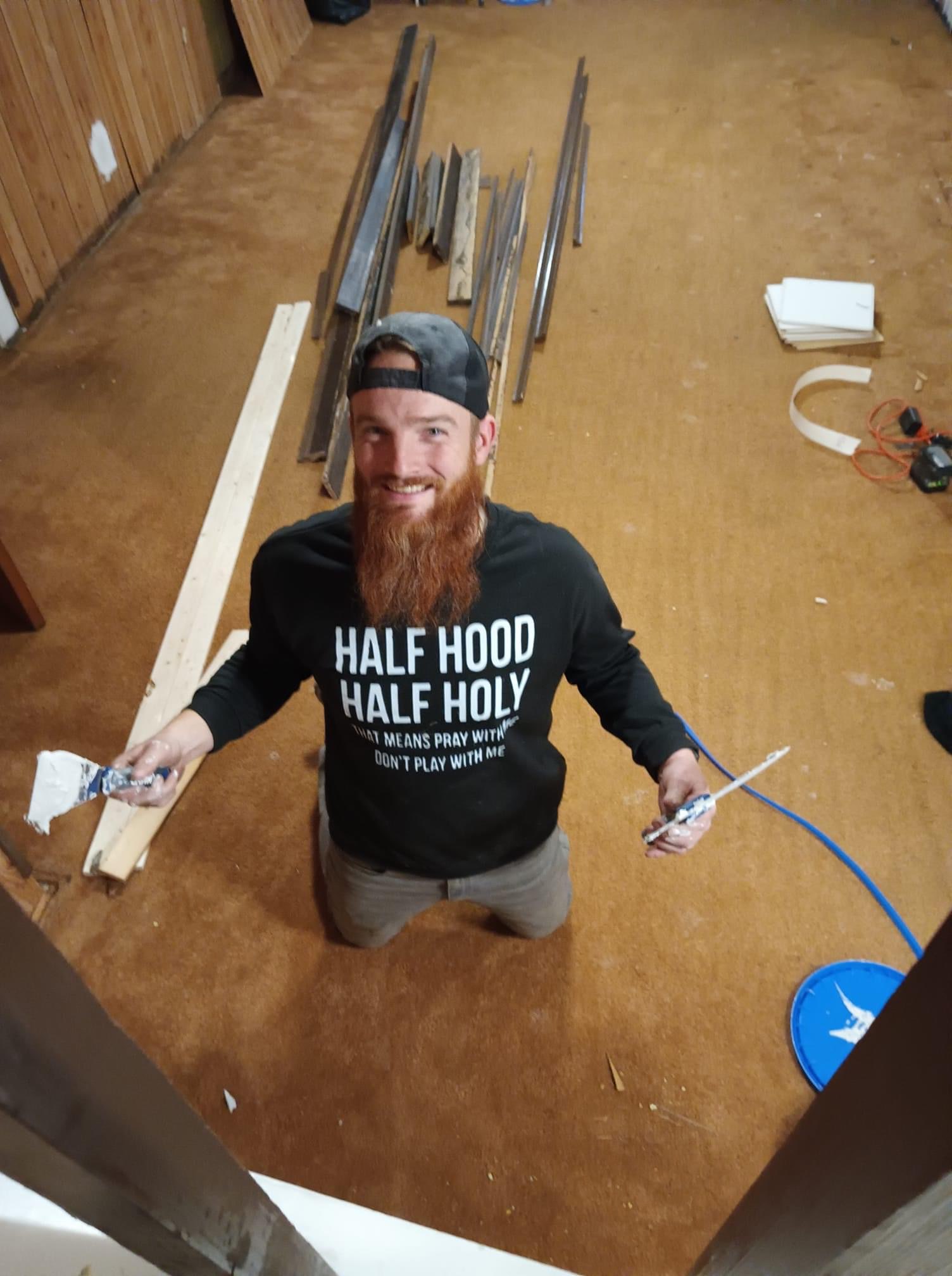 A single craftsman working diligently on a flooring project